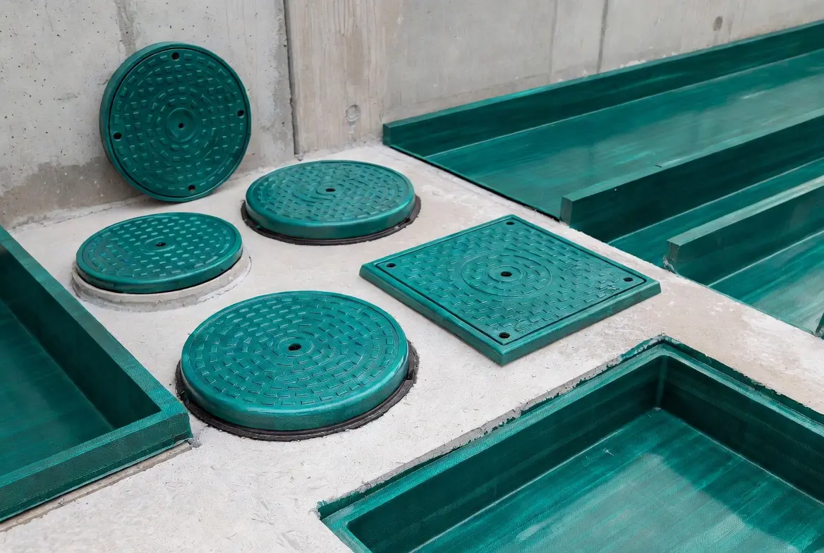 Durable green GRP marine components including saltwater-proof hatch covers and deck structures for boats and offshore vessels.