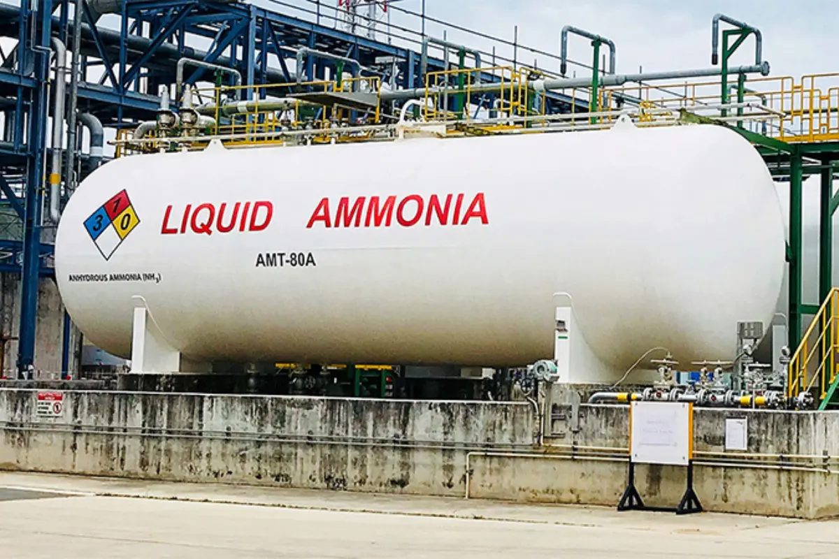 Large horizontal industrial GRP/FRP storage tank for Liquid Ammonia and Ammonium Nitrate solutions at a chemical processing plant.