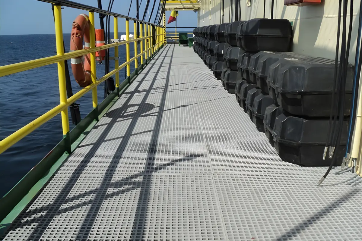 Non-slip and rust-proof GRP gratings installed on an offshore deck walkway by Global Fiberglass Company.